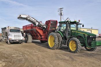 Honey Boom Boom. The boom located on the passenger side of the Redline Honey Badger moves sugarbeets or potatoes our of the bin.